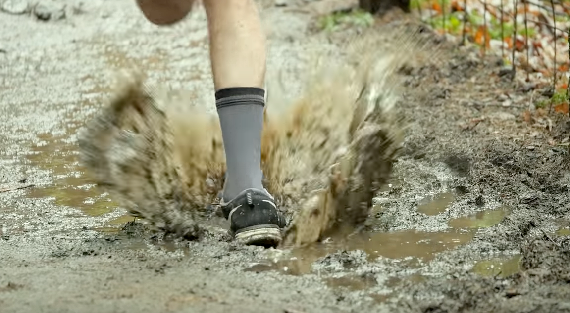 Load video: Customer using waterproof socks demonstrating how they make his rainy days on the bike better.