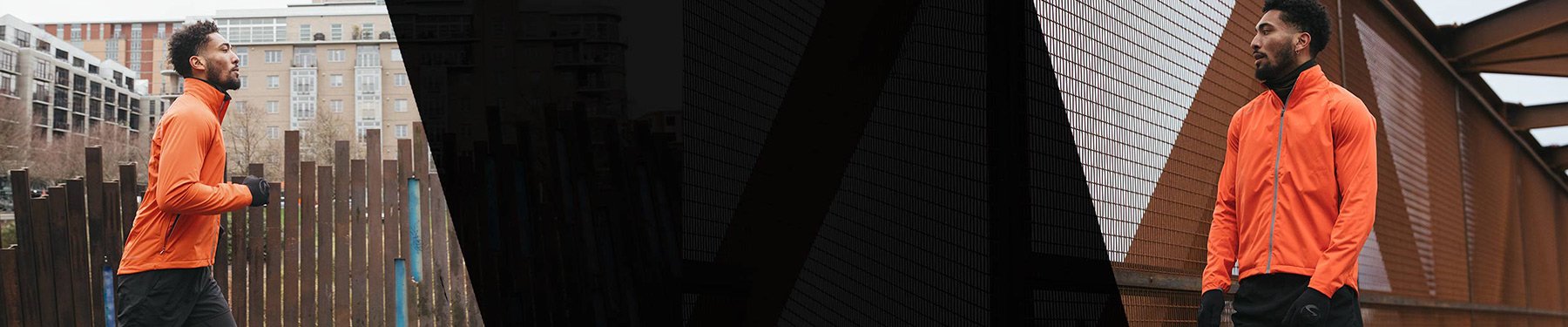 A man wearing orange and black Showers Pass running apparel, jogging through downtown Portland and stopping on a bridge.